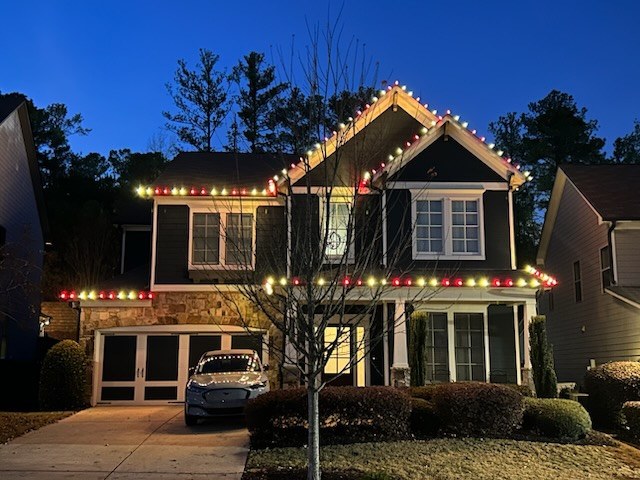 Multi color red and white C9 Christmas light installation on Atlanta GA craftsman home