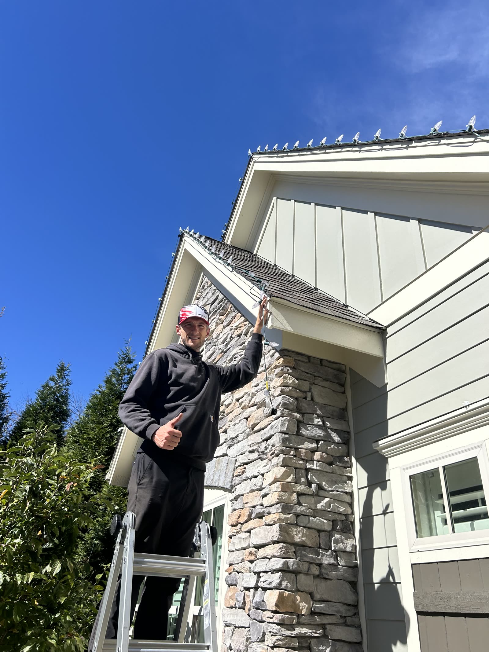 Dreamland crew member after installing C9 roofline lights on an Atlanta home