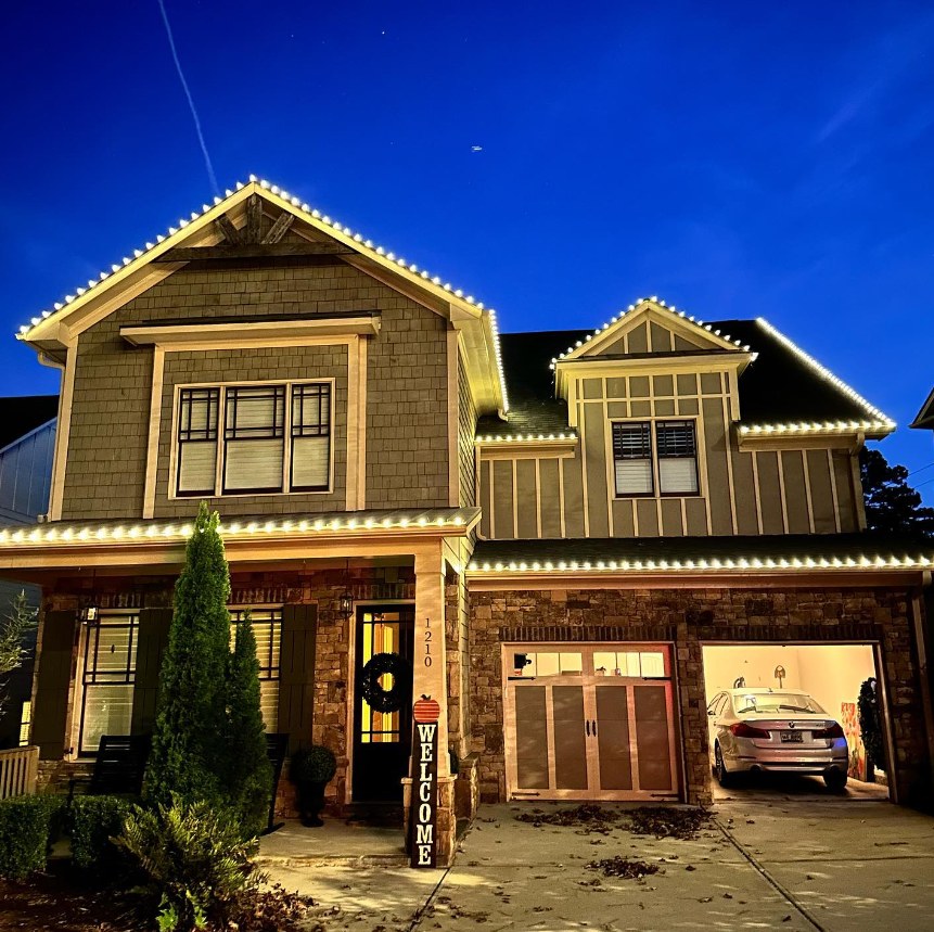 Warm white C9 roofline Christmas lights on craftsman home in Marietta GA