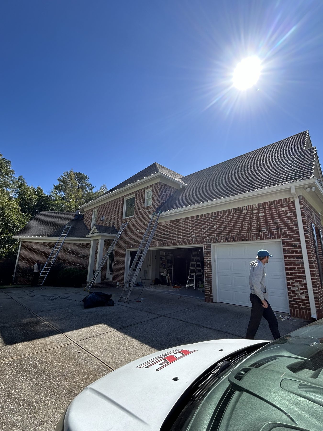 Christmas light installation crew setting up lights on an Atlanta home