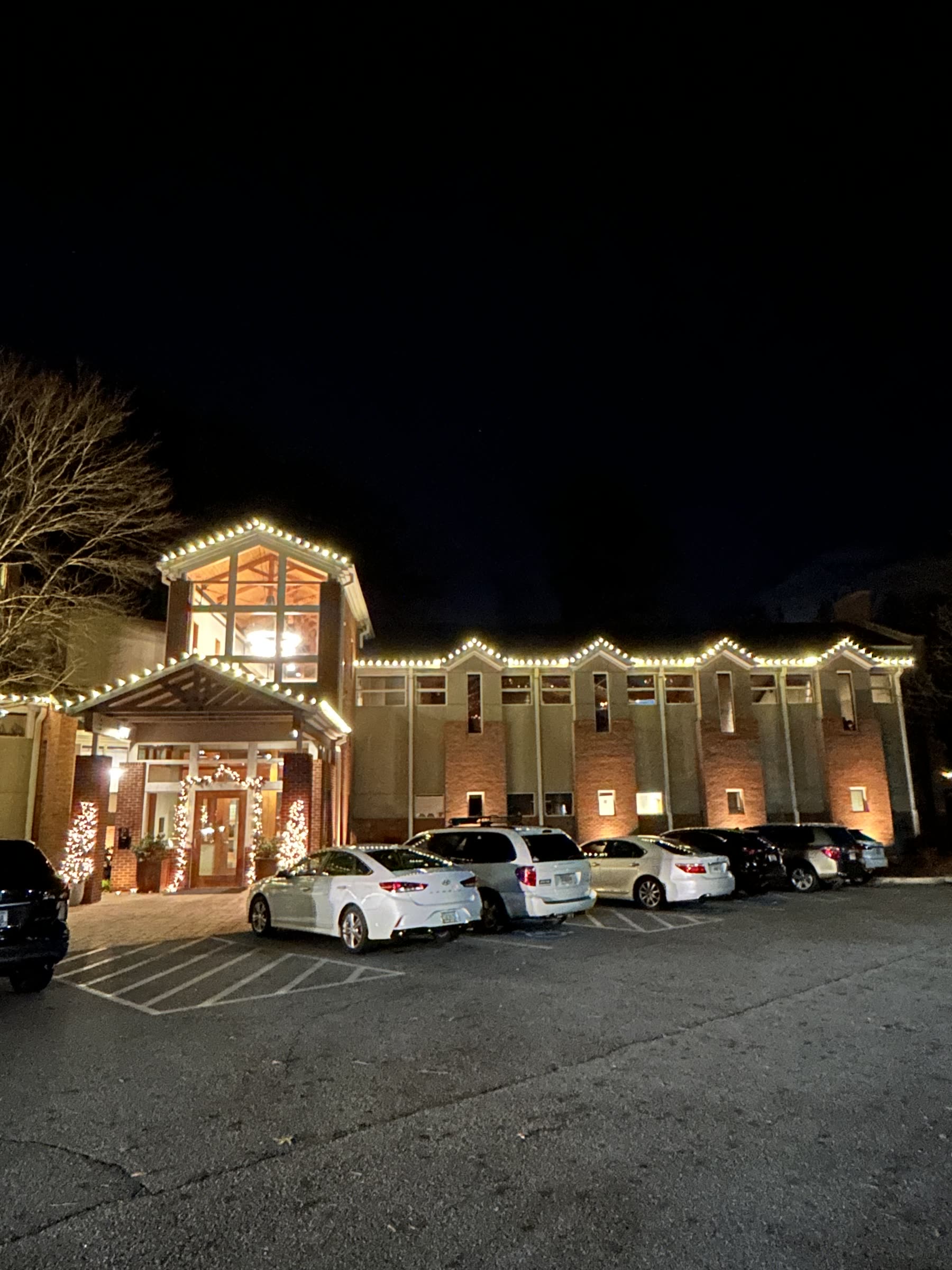 Brick church with warm white Christmas lights in Atlanta