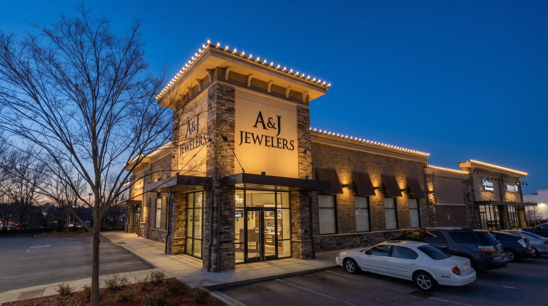A&J Jewelers commercial Christmas light installation in Atlanta GA with warm white roofline lights