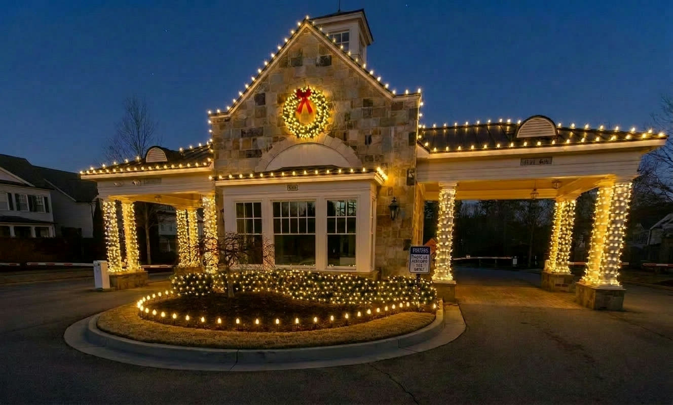 HOA security gatehouse with warm white Christmas lights in Atlanta GA